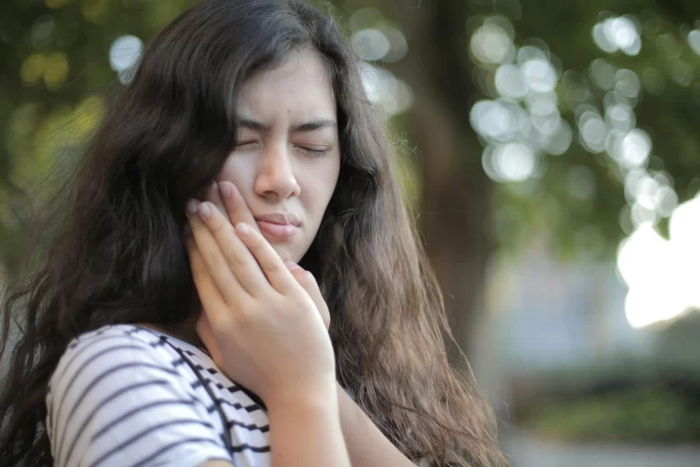 Woman With Tooth Ache Seeking Natural Pain Relief