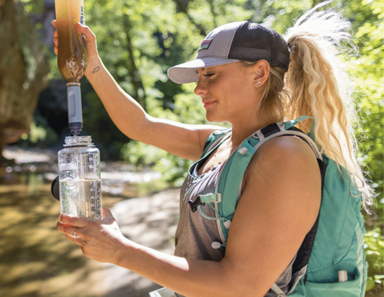 LifeStraw Peak Solo review - showing the fast flow water filter on a trail.